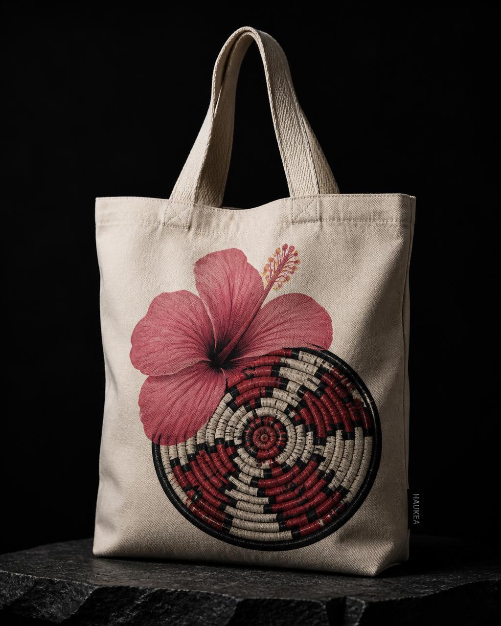 Natural canvas tote bag printed with a pink hibiscus and coiled basket pattern